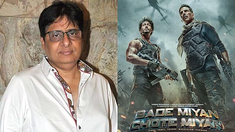 Vashu Bhagnani and the poster of Bade Miyan Chote Miyan