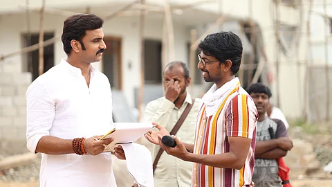 A still of Rakesh Varre and director Virinchi Varma on sets
