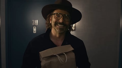 Everything is okay in the trailer for Bradley Cooper's Is This Thing On?