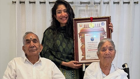 Sai Pallavi poses with Grandparents after winning Kalaimamani award; pens note