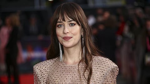 Dakota Johnson recalls losing role for "shaking everyone's hands" at audition