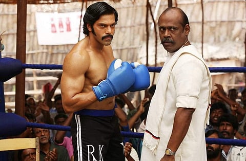 Arya and Pasupathy in a still from Sarpatta Parambarai