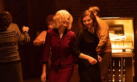 Stills from Eileen featuring Anne Hathaway and Thomasin McKenzie are out