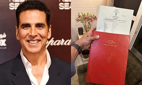 Akshay Kumar showing his Indian citizenship documents