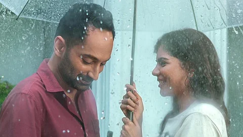 Fahadh and Kalyani share a tender moment in new Odum Kuthira Chaadum Kuthira poster