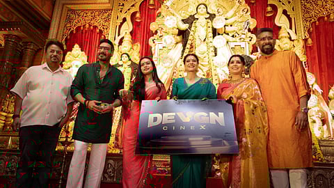 Ajay Devgn, Nysa Devgn and Kajol unveiling the logo of Devgn Cinex