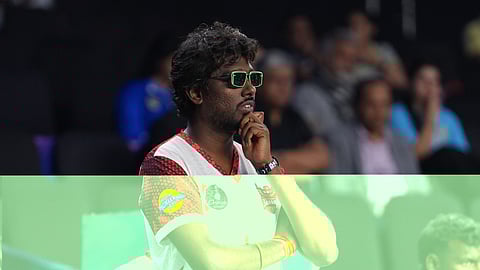 Atlee watching the pickleball game