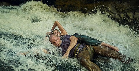 Apex Review: Charlize Theron muscles her way through vacuous script
