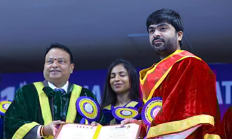Simbu being honoured with the doctorate certificate