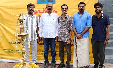 Rajesh Madhavan and his film's crew in its pooja function